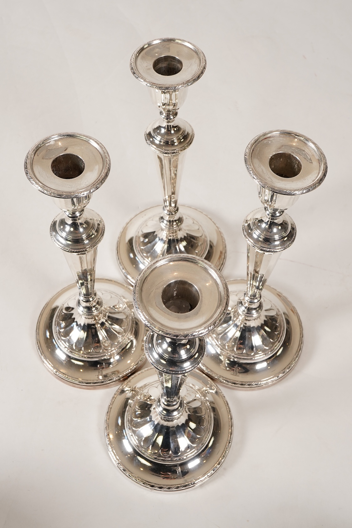 A set of four George III silver candlesticks, by John Green, Roberts, Mosley & Co
